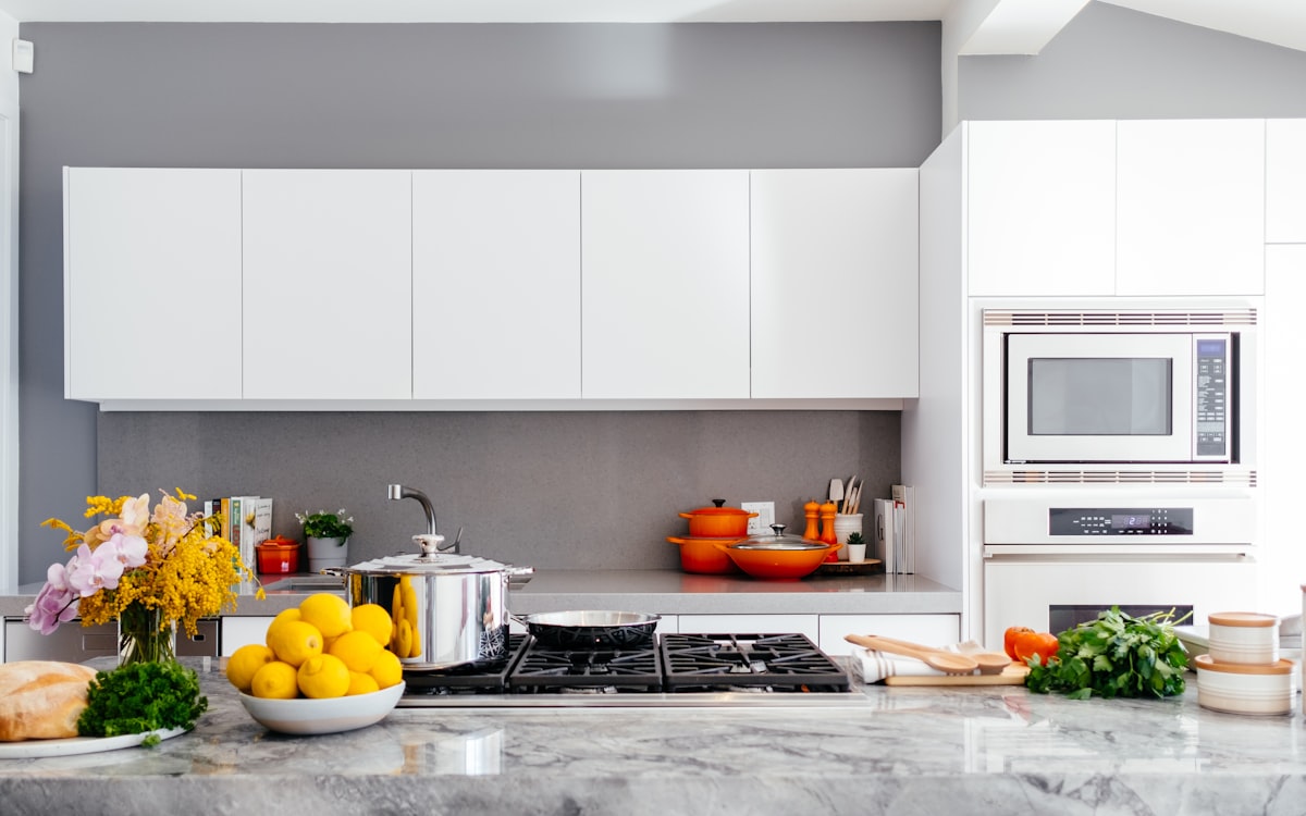 Modern white kitchen with marble island