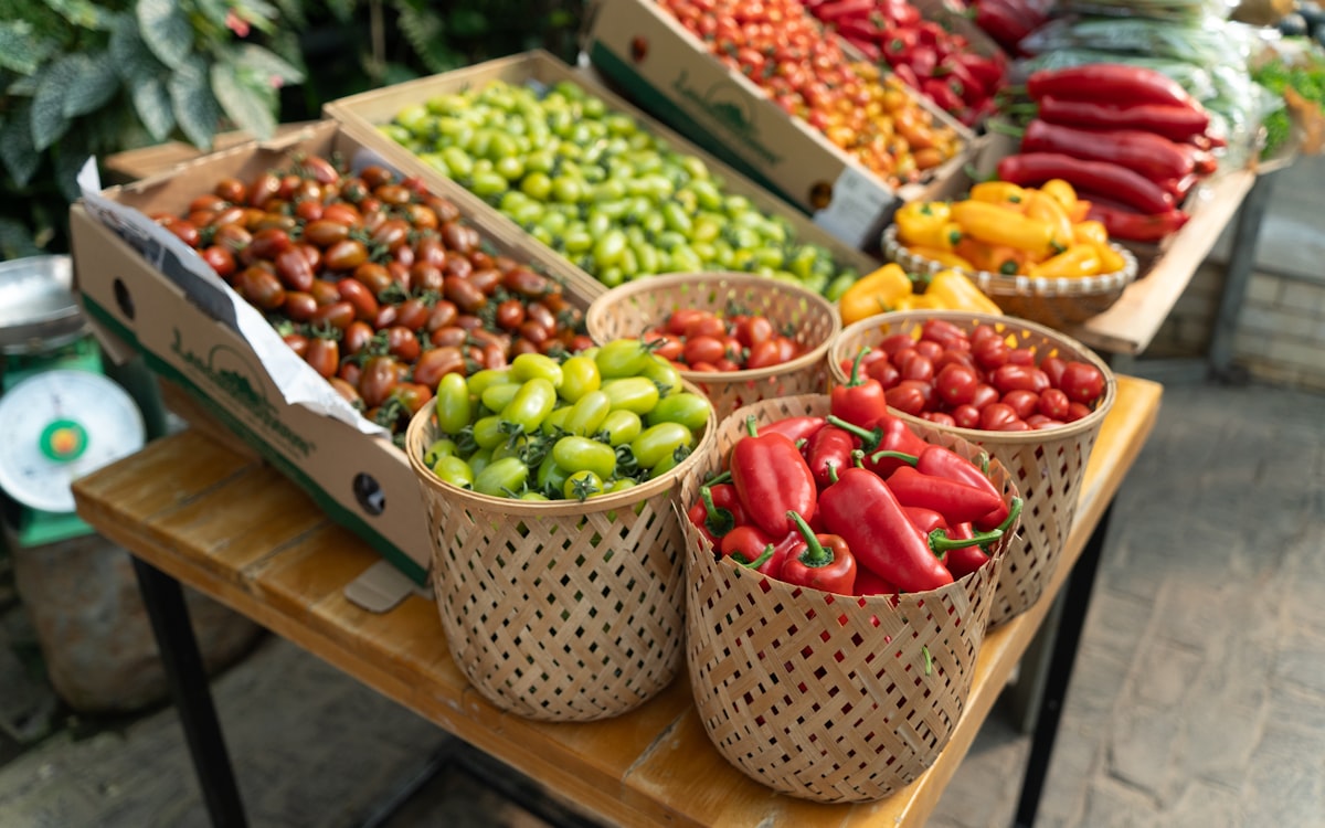 Fresh produce including tomatoes and peppers at a market