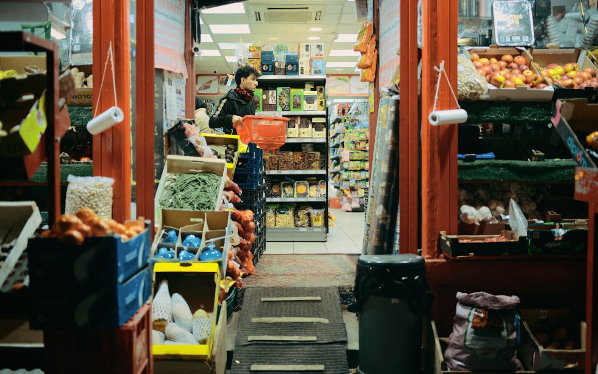 Inside a small grocery store filled with produce